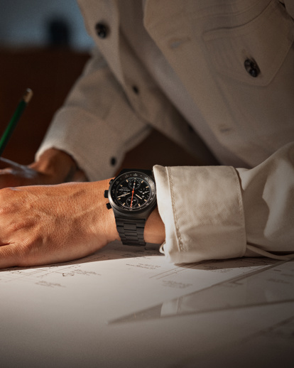 Shows Picture of man-writing-on-plan-watch-on-wrist.jpg